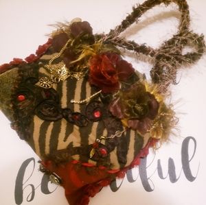 A clutch adorned with embellishments and beads